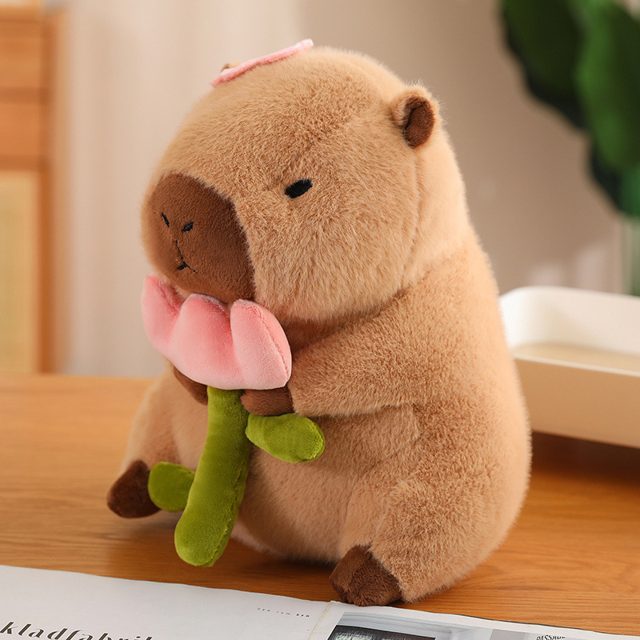 Capybara Holding a Pink Flower Plush