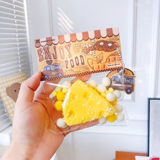 Swiss Cheese Wedge Squishy Keychain